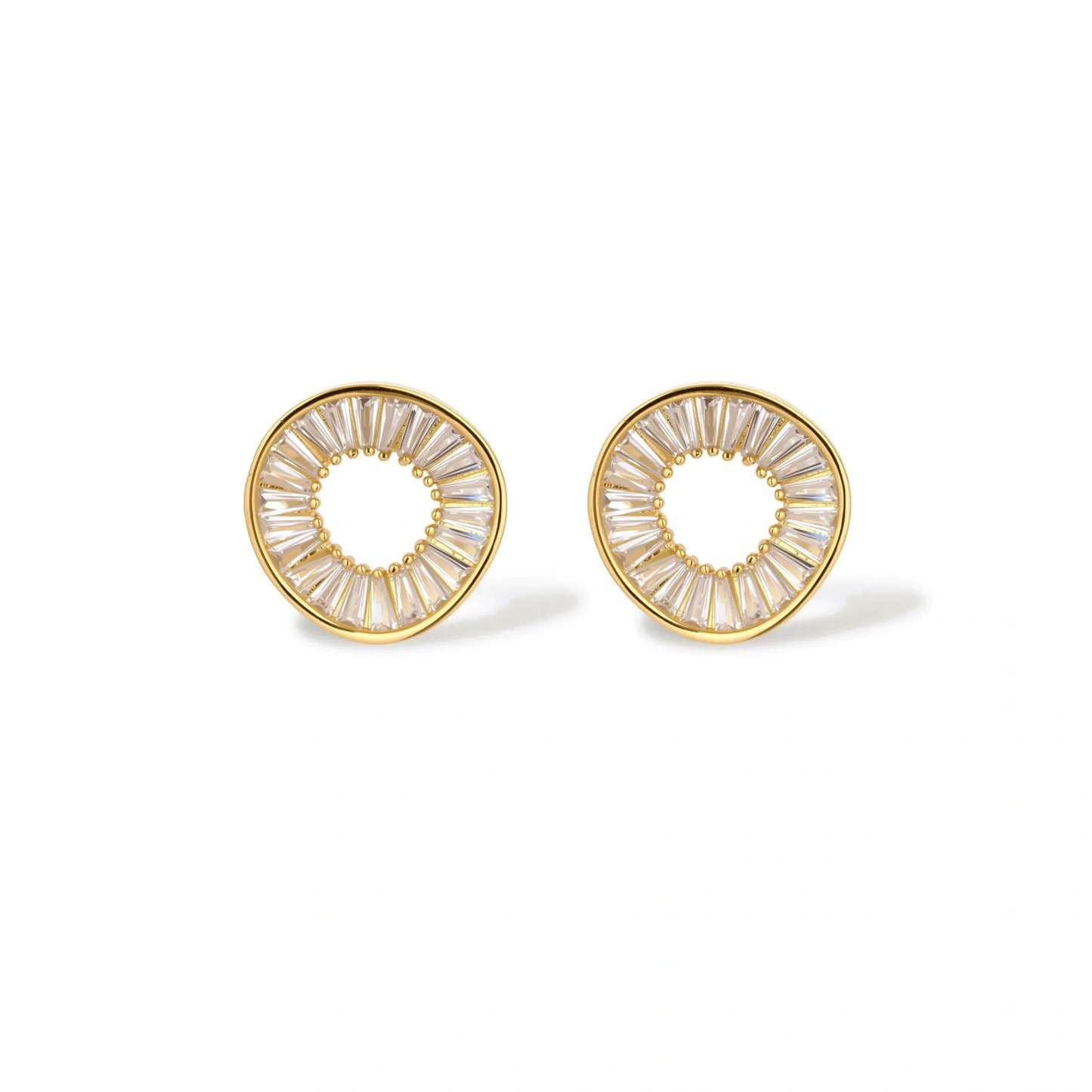 Gold-plated necklace and earring set with circular CZ crystal pendants featuring radial design on cream background