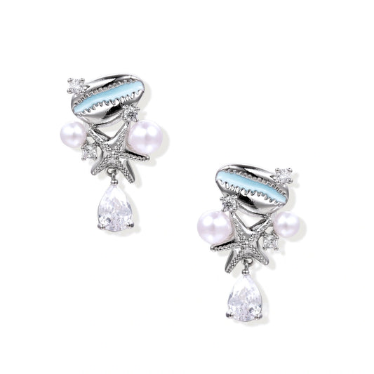 Ocean-themed drop earrings with blue enamel shells, white pearls, starfish charms and crystal teardrops on white background.