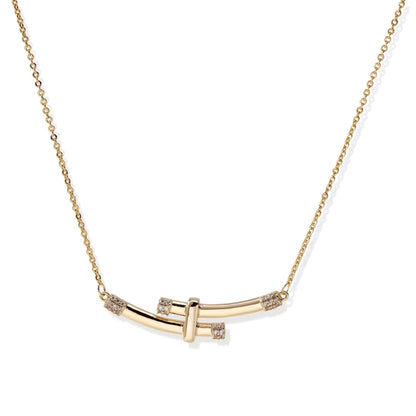 Gold-plated curved bar necklace with diamond accents on delicate chain against cream background