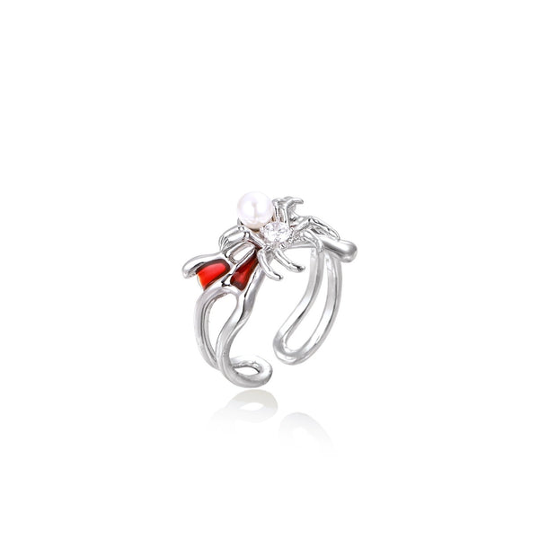 White gold plated spider ring with pearl body, clear zirconia center, and red enamel leg accents on adjustable band