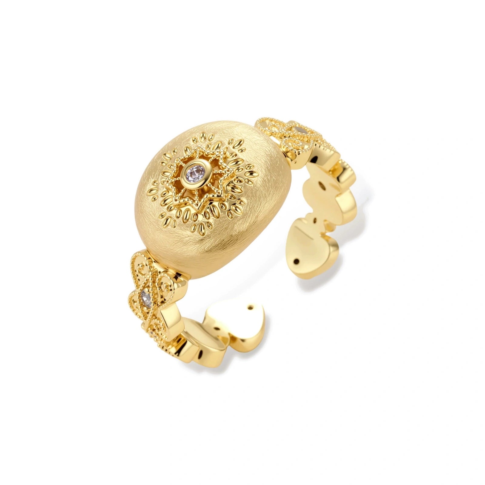 Ornate gold-plated ring with detailed engravings and central zirconia stone on adjustable band