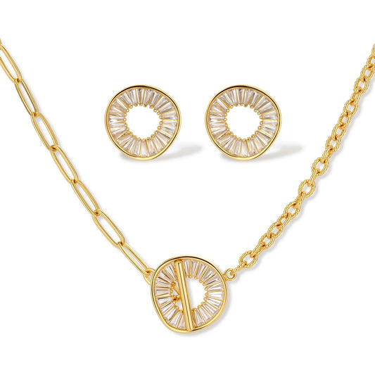 Gold-plated necklace and earring set with circular CZ crystal pendants featuring radial design on cream background